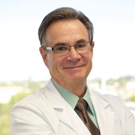 Dr. Stone, a specialist in tooth extractions and dental implants