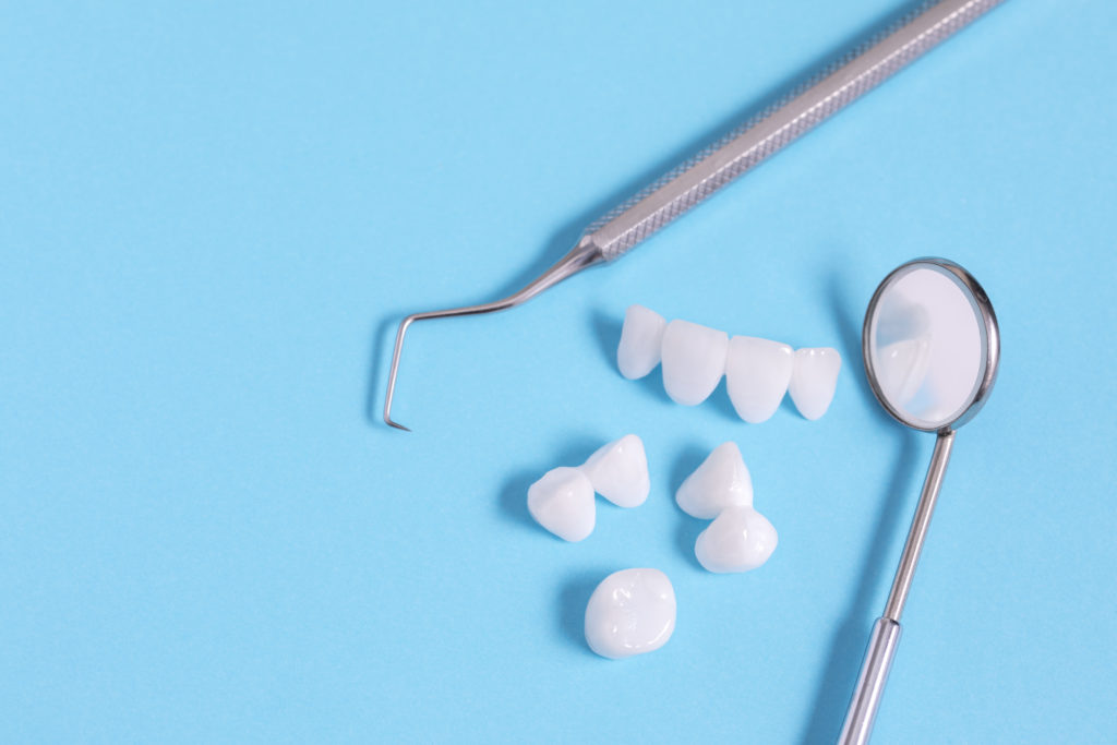 can my dentist place my crown or implant?